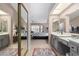 Double vanity bathroom with a large mirror and plenty of counter space at 19822 N Zion Dr, Sun City West, AZ 85375