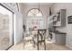 Kitchen breakfast nook with a glass table and built-in shelving at 19822 N Zion Dr, Sun City West, AZ 85375