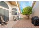 Private patio with comfortable seating and a small citrus tree at 19822 N Zion Dr, Sun City West, AZ 85375