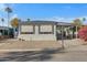 Mobile home exterior with carport and landscaping at 201 S Greenfield Rd # 205, Mesa, AZ 85206