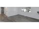 Clean hallway with gray laminate flooring and access to other rooms at 201 S Greenfield Rd # 205, Mesa, AZ 85206