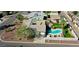 An elevated view of a well-maintained house, highlighting its landscaping and surrounding neighborhood at 2146 E Whitton Ave, Phoenix, AZ 85016