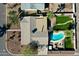 An aerial view of a house and its backyard, complete with refreshing pool and ample space for outdoor activities at 2146 E Whitton Ave, Phoenix, AZ 85016