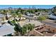 Scenic aerial shot of a home, emphasizing its backyard with mature landscaping and neighborhood setting at 2146 E Whitton Ave, Phoenix, AZ 85016