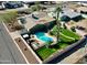 Aerial view showing a backyard pool, manicured lawn, and desert landscaping at 2146 E Whitton Ave, Phoenix, AZ 85016