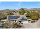 Aerial view showing house with solar panels, large backyard, and mountain views at 24444 N 40Th Ln, Glendale, AZ 85310