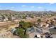 Aerial view showcasing a house with solar panels and a swimming pool, nestled in a residential area at 24444 N 40Th Ln, Glendale, AZ 85310