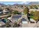 Aerial view of house with solar panels, pool, and desert landscape at 24444 N 40Th Ln, Glendale, AZ 85310