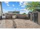 Spacious backyard with detached garage, storage shed, and paved pathway at 24444 N 40Th Ln, Glendale, AZ 85310