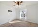 Simple bedroom with neutral decor and a ceiling fan at 24444 N 40Th Ln, Glendale, AZ 85310