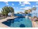 Inviting backyard pool with waterfall feature, slide, and basketball hoop at 24444 N 40Th Ln, Glendale, AZ 85310