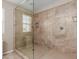 Large bathroom with a walk-in shower and tiled walls at 314 N 79Th Pl, Mesa, AZ 85207