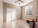 Spacious bedroom with tile floors and double doors at 314 N 79Th Pl, Mesa, AZ 85207