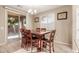 Kitchen dining area with wood table and access to backyard at 314 N 79Th Pl, Mesa, AZ 85207