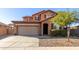 Two-story house with attached garage and landscaped front yard at 314 N 79Th Pl, Mesa, AZ 85207