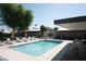 Inviting community pool with lounge chairs and patio tables at 4216 N 38Th St # C, Phoenix, AZ 85018