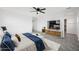 Bright bedroom featuring modern furnishings, a large flat screen TV, and a ceiling fan at 779 S La Mesa Ct, Casa Grande, AZ 85122