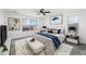 Beautiful bedroom with a ceiling fan, large windows, cozy decor, and an accent rug at 779 S La Mesa Ct, Casa Grande, AZ 85122