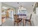 Bright dining area with wooden table and kitchen view at 7960 E Madero Ave, Mesa, AZ 85209