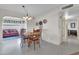 Open dining area with a view of the living room and hallway at 7960 E Madero Ave, Mesa, AZ 85209