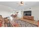 Living room featuring a large TV, comfy seating, and wood flooring at 7960 E Madero Ave, Mesa, AZ 85209