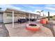 Spacious patio with fire pit, dining area, and BBQ grill at 7960 E Madero Ave, Mesa, AZ 85209