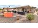 Covered patio features dining area and comfortable seating at 7960 E Madero Ave, Mesa, AZ 85209