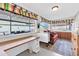 Sunroom features a red couch, a desk, and large windows at 7960 E Madero Ave, Mesa, AZ 85209