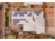 Aerial view of a home with solar panels on the roof and mature landscaping at 813 E Glendale Ave, Phoenix, AZ 85020