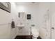 Bathroom featuring a floating sink, a modern toilet and light paint color at 813 E Glendale Ave, Phoenix, AZ 85020