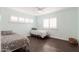 Bedroom with two beds and plantation shutters allowing natural light at 813 E Glendale Ave, Phoenix, AZ 85020