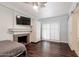 Serene bedroom featuring hardwood floors and a decorative fireplace at 813 E Glendale Ave, Phoenix, AZ 85020