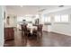 Dining area with a large table adjacent to a bright kitchen with an island and stainless appliances at 813 E Glendale Ave, Phoenix, AZ 85020