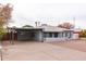 Exterior view of a charming single story home showing a covered carport and front entry at 813 E Glendale Ave, Phoenix, AZ 85020