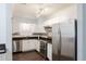 Updated kitchen with stainless steel appliances and white cabinetry at 813 E Glendale Ave, Phoenix, AZ 85020