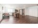 Bright living room with a ceiling fan, lots of seating, and built-in bookshelves at 813 E Glendale Ave, Phoenix, AZ 85020