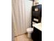 Clean bathroom with shower/tub combo and storage at 8213 S 25Th St, Phoenix, AZ 85042