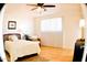 Bright bedroom with tiled floor, ceiling fan, and comfy bed at 8213 S 25Th St, Phoenix, AZ 85042