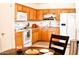 Bright kitchen with light wood cabinets, white appliances, and a tiled floor at 8213 S 25Th St, Phoenix, AZ 85042