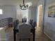 Formal dining room with a large table and gray upholstered chairs at 8605 W Carole Ln, Glendale, AZ 85305