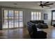 Living room with sliding glass doors leading to a view of the pool at 8605 W Carole Ln, Glendale, AZ 85305