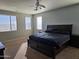 Bright main bedroom with a large bed and plenty of natural light at 8605 W Carole Ln, Glendale, AZ 85305