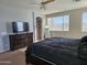 Main bedroom with a dresser, TV, and large bed at 8605 W Carole Ln, Glendale, AZ 85305