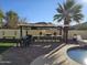 Outdoor kitchen with seating and built-in grill at 8605 W Carole Ln, Glendale, AZ 85305