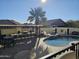 Inviting backyard oasis with a kidney-shaped pool and outdoor kitchen at 8605 W Carole Ln, Glendale, AZ 85305