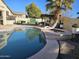 Enjoy this refreshing kidney shaped pool with spa and outdoor kitchen at 8605 W Carole Ln, Glendale, AZ 85305