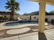 Relaxing kidney-shaped pool with a spa and covered patio at 8605 W Carole Ln, Glendale, AZ 85305