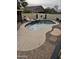 Backyard swimming pool with a lounge area and beautiful hardscape at 8605 W Carole Ln, Glendale, AZ 85305