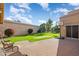 Landscaped backyard, putting green, and patio area at 9377 E Corrine Dr, Scottsdale, AZ 85260