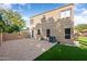 Backyard with patio, artificial turf, and partial view of house at 9377 E Corrine Dr, Scottsdale, AZ 85260